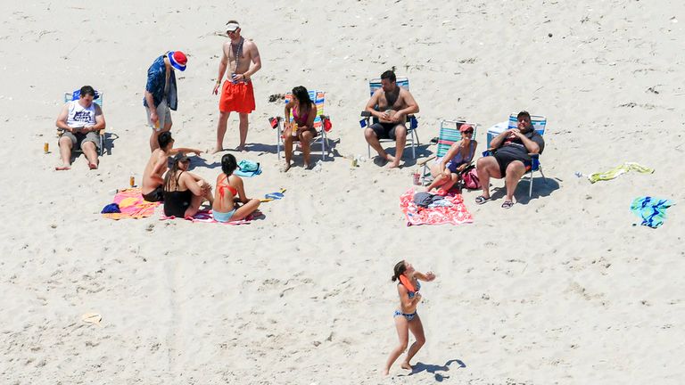 FILE - In this July 2, 2017, file photo, New Jersey Gov. Chris Christie, right, uses the beach with his family and friends at the governor&#39;s summer house at Island Beach State Park, N.J., when the state park was closed to the public during a government shutdown in New Jersey. Pic: AP