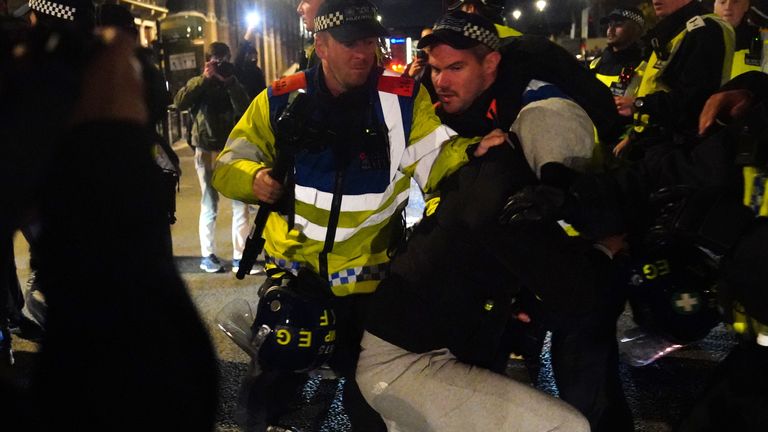 A counter-protester is detained police in Parliament Square in central London, after a pro-Palestinian protest march which was taking place from Hyde Park to the US embassy in Vauxhall. Picture date: Saturday November 11, 2023.