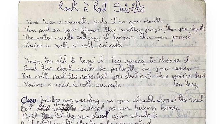 The double-sided lined paper features the lyrics to Rock N Roll Suicide and Suffragette City 
