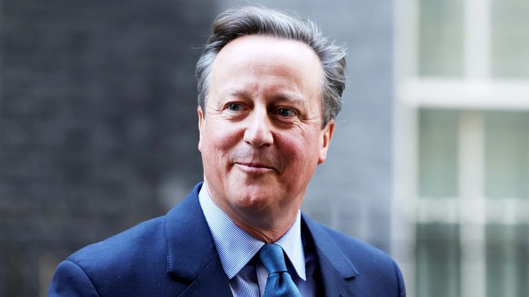 Former Prime Minister and newly appointed Foreign Secretary David Cameron walks outside 10 Downing Street