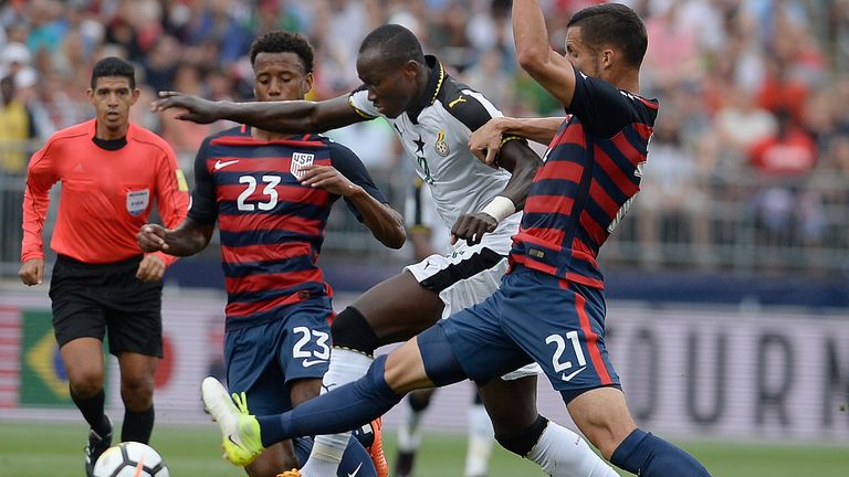 FILE - United States&#39; Kellyn Acosta, left, and Matt Hedges, right, pressure Ghana&#39;s Raphael Dwamena, center, during the first half of an international friendly soccer match at Pratt & Whitney Stadium at Rentschler Field, Saturday, July 1, 2017, in East Hartford, Conn. Former Ghana striker Raphael Dwamena has died after collapsing Saturday, Nov. 11, 2023, during an Albanian Super League soccer match. (AP Photo/Jessica Hill, FIle)