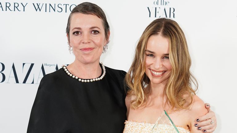 Emilia Clarke with the Actress of the Year award, presented by Olivia Colman (left), at the Harper&#39;s Bazaar Women of the Year 2023 awards at Claridges, London. Picture date: Tuesday November 7, 2023.