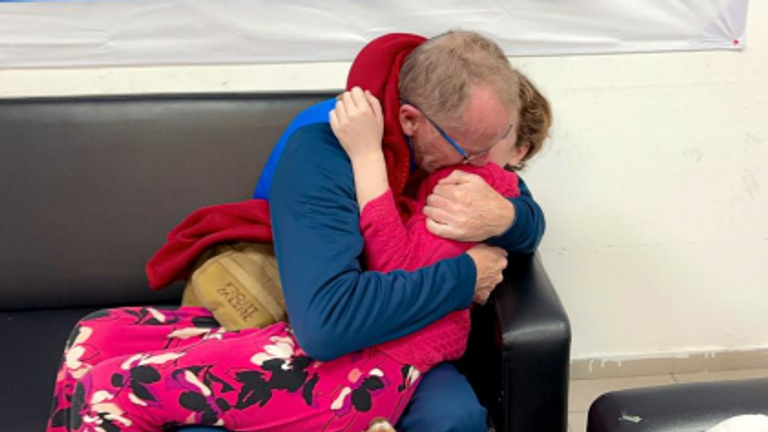 Emily Hand is reunited with her father Thomas Hand after being released by Hamas after spending seven weeks as a hostage. Pic: IDF