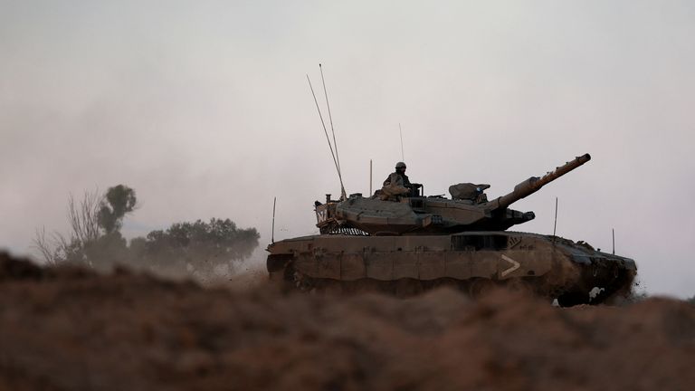 A tank manoeuvres near the border with Gaza, amid the ongoing conflict between Israel and the Palestinian Islamist group Hamas, in southern Israel, November 21, 2023. REUTERS/Ronen Zvulun
