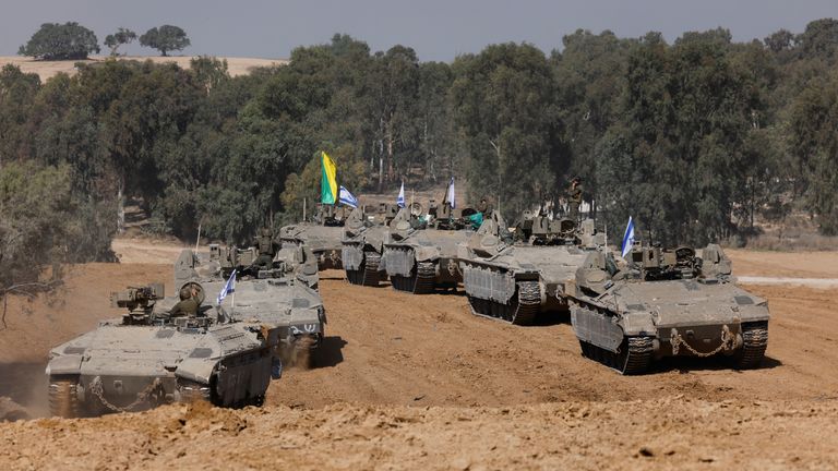 Israeli military vehicles maneuver near Israel&#39;s border after leaving Gaza, during the temporary truce between the Palestinian Islamist group Hamas and Israel, in Israel, November 24, 2023. REUTERS/Amir Cohen