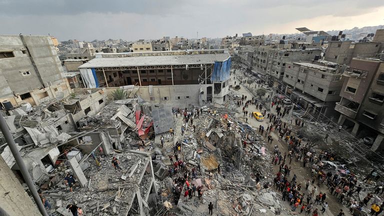 Palestinians inspect the site of airstrikes on houses in Jabalia refugee camp earlier this week
