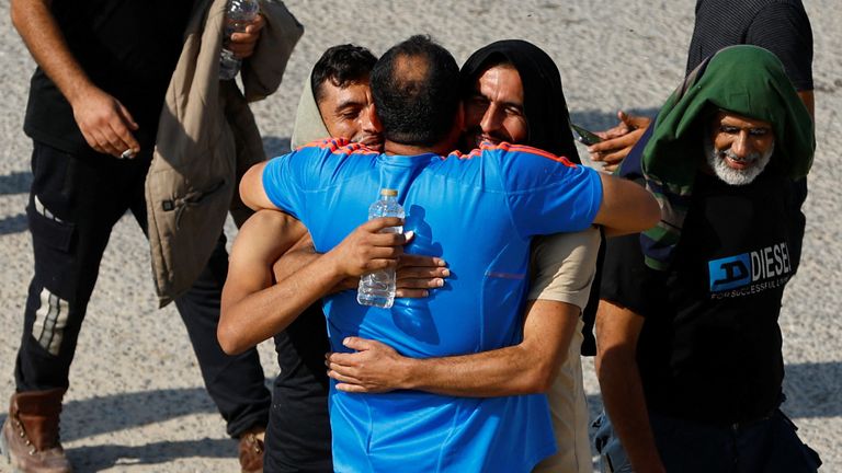 Palestinian workers, who were in Israel during the Hamas October 7 attack, are greeted as they arrive at the Rafah border after being sent back by Israel to the strip, in the southern Gaza Strip, November 3, 2023. REUTERS/Ibraheem Abu Mustafa
