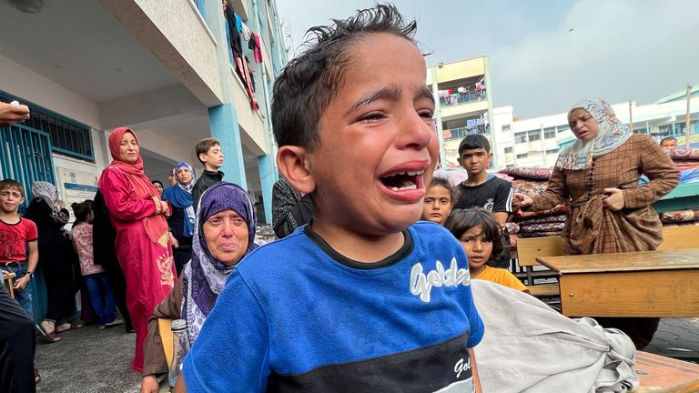 A Palestinian boy weeps at a camp in Jabalia in the northern Gaza Strip