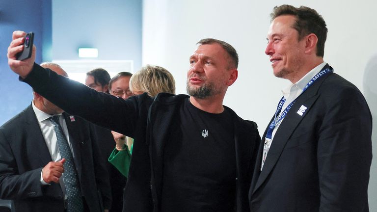 Ukraine&#39;s Deputy Minister of the Digital Transformation Georgi Dubyinsk  and Elon Musk take a selfie during the opening plenary at the AI safety summit