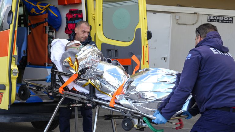 Paramedics transfer a survivor of a shipwreck at a hospital, Lesbos, Greece, Sunday, Nov. 26, 2023. Pic: AP