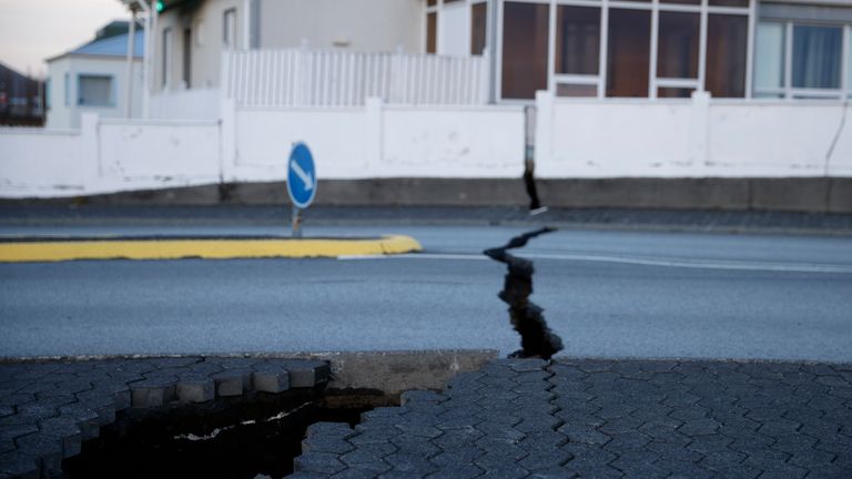 A fissure stretches across a road in the town of Grindavik. Pic: AP