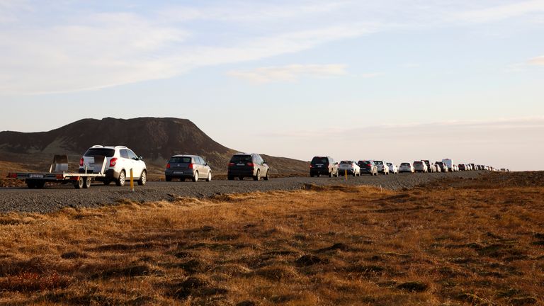 A line of cars queued on a road heading to the town of Grindavik. Pic: AP