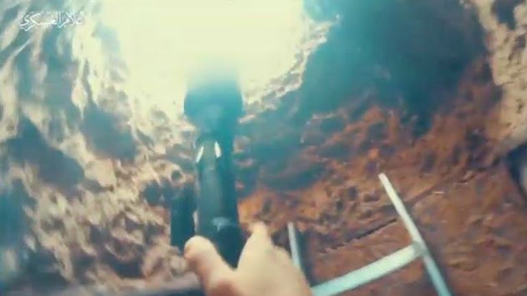 Hamas militants are purportedly shown climbing out of tunnels with their weapons. Pic: Hamas