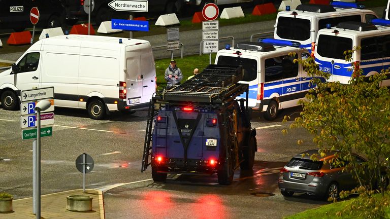  Police cars and a special vehicle at the airport. Pic: AP