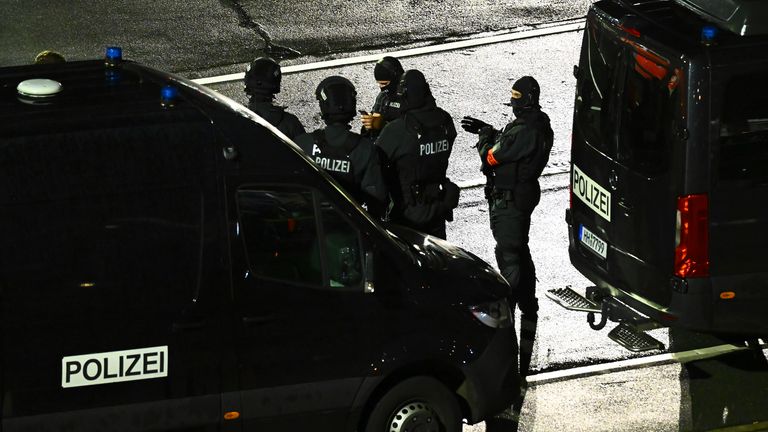 Police officers at Hamburg airport. Pic: AP
