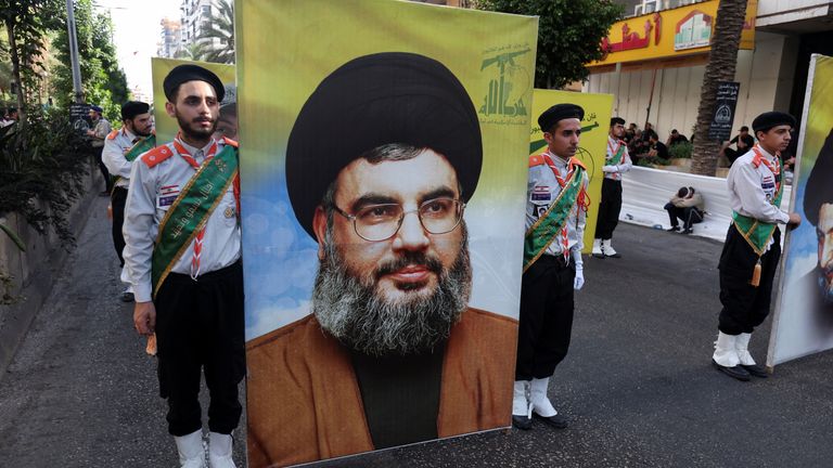 A picture of Hassan Nasrallah is carried during a religious procession in Beirut in July