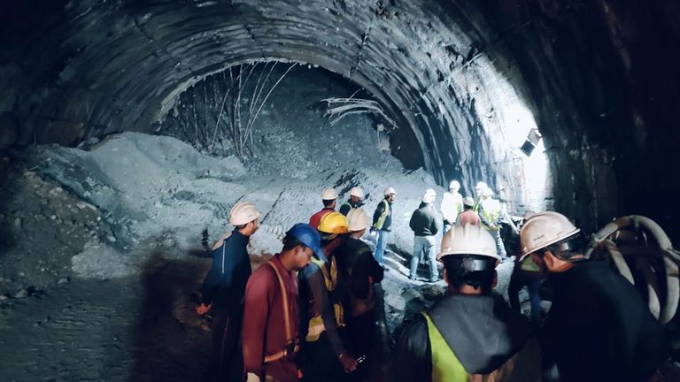 Rescuers inside a collapsed tunnel. Pic: AP