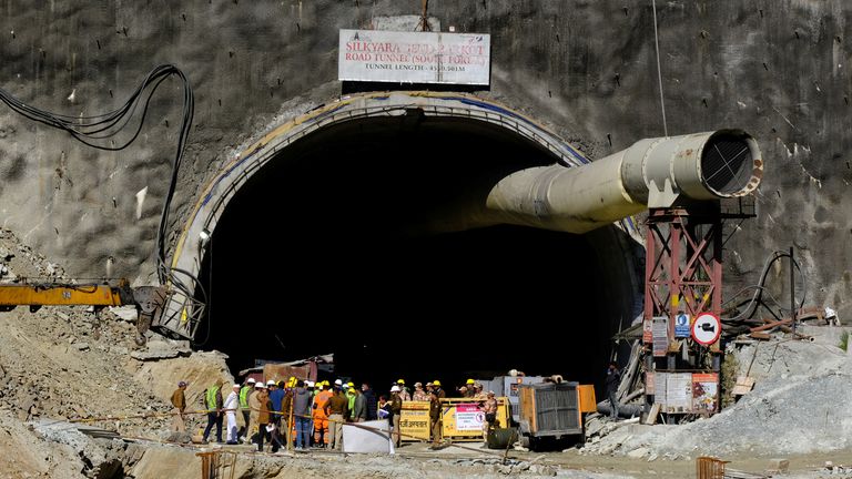 Members of rescue teams stand at the entrance of a tunnel where 40 road workers are trapped after a portion of the tunnel collapsed, in Uttarkashi in the northern state of Uttarakhand, India, November 16, 2023. REUTERS/Shankar Prasad Nautiyal NO RESALES. NO ARCHIVES.