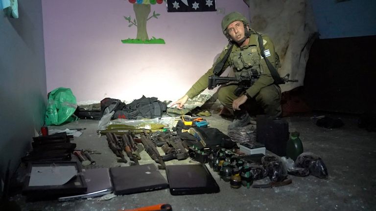 Israeli military spokesperson Rear Admiral Daniel Hagari shows what he says are weapons stored by Hamas in the basement of Rantissi Hospital
Pic:Israel Defence Forces/Reuters