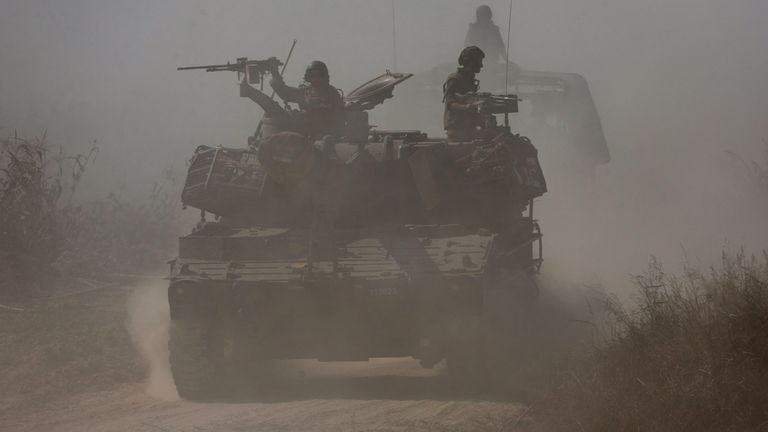 Israeli soldiers ride atop an artillery unit near the Israeli side of the border between Israel and the Gaza Strip, November 3, 2023. REUTERS/Amir Cohen TPX IMAGES OF THE DAY
