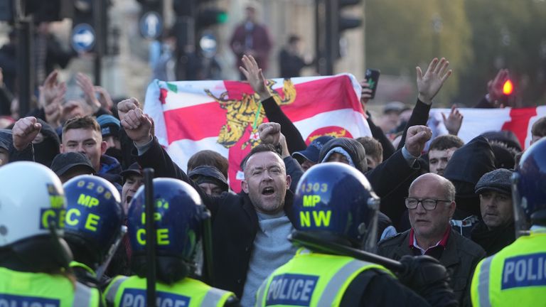 Counter-protesters and police in Parliament Square in central London, during pro-Palestinian protest march which is taking place from Hyde Park to the US embassy in Vauxhall. Picture date: Saturday November 11, 2023.