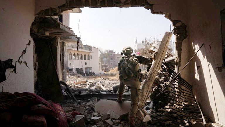 An Israeli soldier takes part in ground operation at a location given as Gaza  
Pic:Israeli Defence Forces/Reuters
