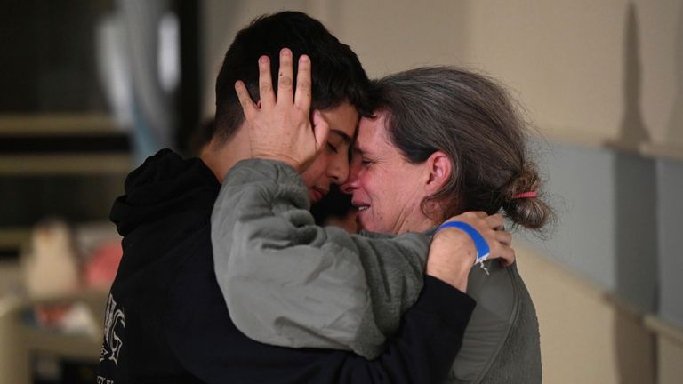 HANDOUT - 25 November 2023, Israel, Ramat Gan: Sharon Hertzman (R) huggs hugs her son Omer at Sheba Medical Center, as she released by Hamas militants, amid a hostages-prisoners swap deal between Hamas and Israel. Photo by: Haim Zach/picture-alliance/dpa/AP Images