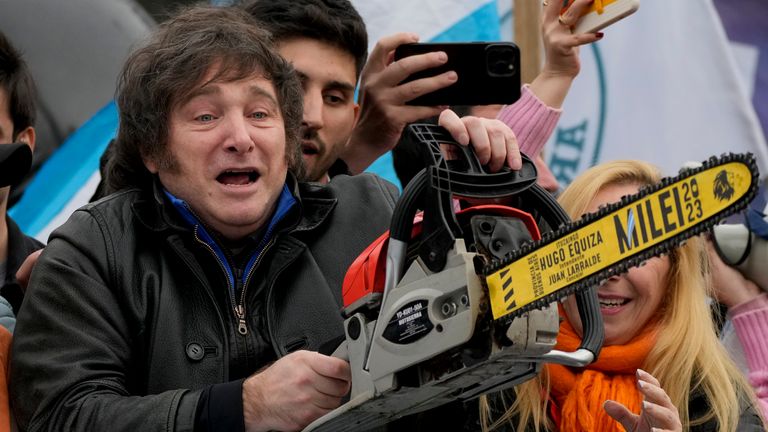 Javier Milei used to carry a chainsaw at his early rallies as a symbol of his planned cuts. Pic: AP