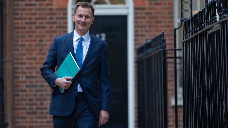 Jeremy Hunt leaves Downing Street to deliver the autumn statement in the Commons
