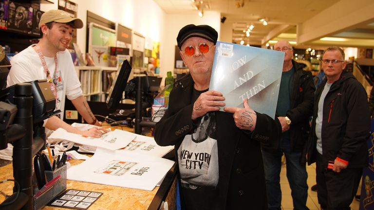 Beatles superfan, John Lennon, who changed his name by deed poll from Alan Williams in April 2022, holds the first copy of the newly released last Beatles song, Now And Then, following a special midnight launch event at HMV Liverpool, allowing fans in the home city of the four Beatles members to be the first to get their hands on the new music. Picture date: Friday November 3, 2023. Picture date: Friday November 3, 2023.