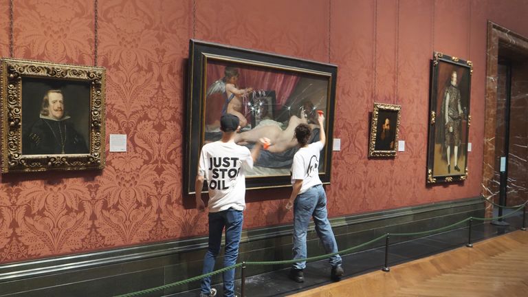 Handout photo issued by Just Stop Oil of two Just Stop Oil protesters smashing a painting at the National Portrait Gallery in London. Picture date: Monday November 6, 2023.