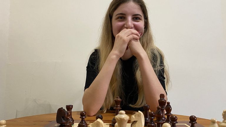 Kamila Hryshchenko plays chess with reporter Michael Drummond