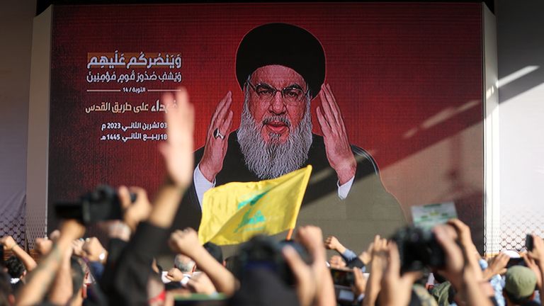 Lebanon&#39;s Hezbollah leader Sayyed Hassan Nasrallah appears on a screen as he addresses his supporters during a ceremony to honour fighters killed in the recent escalation with Israel, in Beirut&#39;s southern suburbs, Lebanon