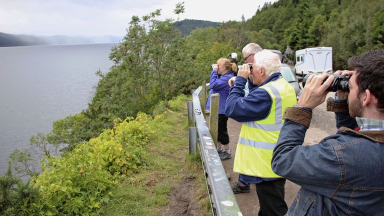 Volunteers watch the surface of Loch Ness in the Highlands of Scotland on Aug. 27, 2023, for signs of the legendary monster Nessie. Two groups undertook the biggest search for Nessie in 50 years on Aug. 26 and Aug. 27, with around 100 volunteers taking part each day.