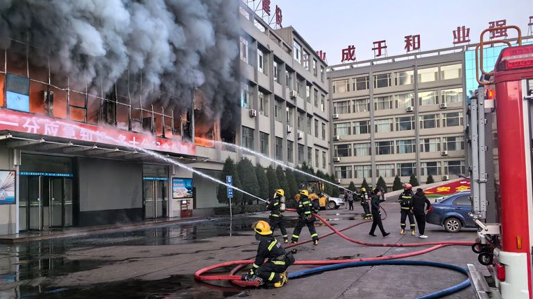 Firefighters try to put out a fire at a building of a coal mine company in Lyuliang City
Pic:Xinhua/Shutterstock
