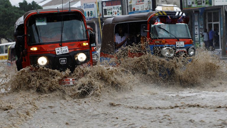 Motorists drive through a flooded street following heavy rains in Mogadishu, Somalia November 8, 2023 REUTERS/Feisal Omar