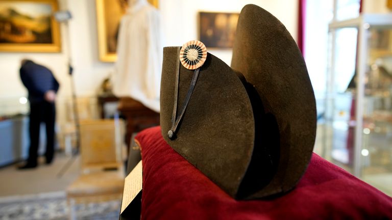 One of the signature broad, black hats that Napol..on wore when he ruled 19th century France and waged war in Europe is on display at Osenat&#39;s auction house in Fontainebleau, south of Paris, Friday, Nov. 17, 2023. The hat is tipped to fetch more than half a million euros (dollars) at the auction Sunday of Napoleonic memorabilia patiently collected by a French industrialist. (AP Photo/Christophe Ena)
