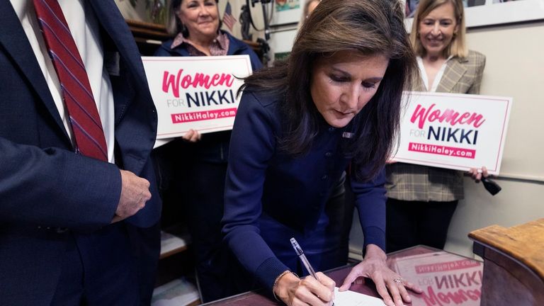 Former U.N. Ambassador Nikki Haley signs papers to get on the Republican presidential primary ballot at the New Hampshire Statehouse, Friday, Oct. 13, 2023, in Concord, N.H. (AP Photo/Michael Dwyer)
