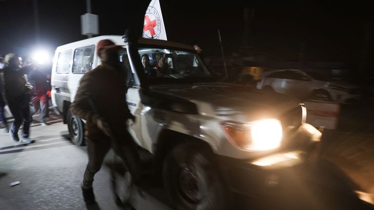 A Red Cross vehicle, as part of a convoy believed to be carrying hostages abducted by Hamas militants during the October 7 attack on Israel, arrives at the Rafah border, amid a hostages-prisoners swap deal between Hamas and Israel, in southern Gaza Strip November 25, 2023. REUTERS/Ibraheem Abu Mustafa