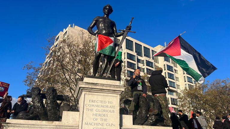 People climb on the Machine Gun Corps Memorial at Wellington Arch during a pro-Palestinian protest in London. Picture date: Saturday November 11, 2023.
