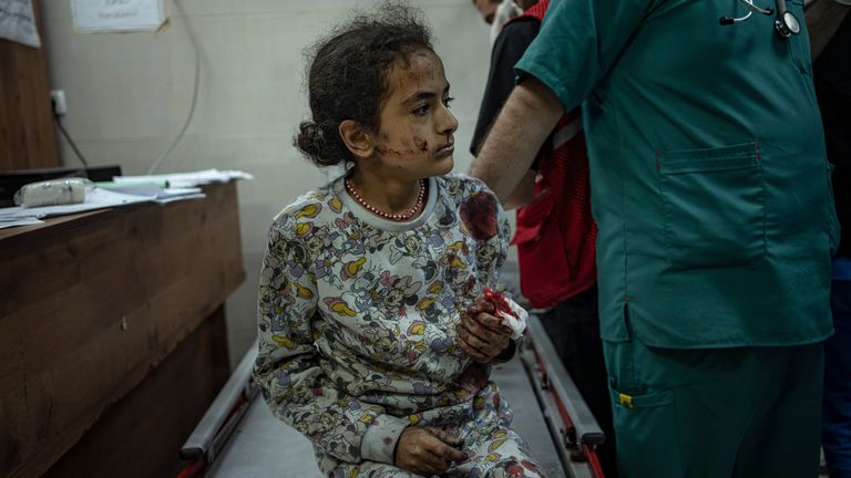 A Palestinian wounded in an Israeli bombardment is brought to a hospital in Khan Younis, Gaza. Pic: AP