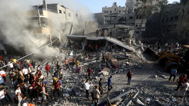 Palestinians look for survivors following an Israeli airstrike at the Khan Younis refugee camp, southern Gaza Strip 
Pic:AP