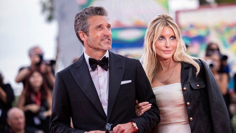 Patrick Dempsey, left, and Jillian Fink pose for photographers upon arrival for the premiere of the film &#39;Ferrari&#39; during the 80th edition of the Venice Film Festival in Venice, Italy, on Thursday, Aug. 31, 2023. (Photo by Vianney Le Caer/Invision/AP)