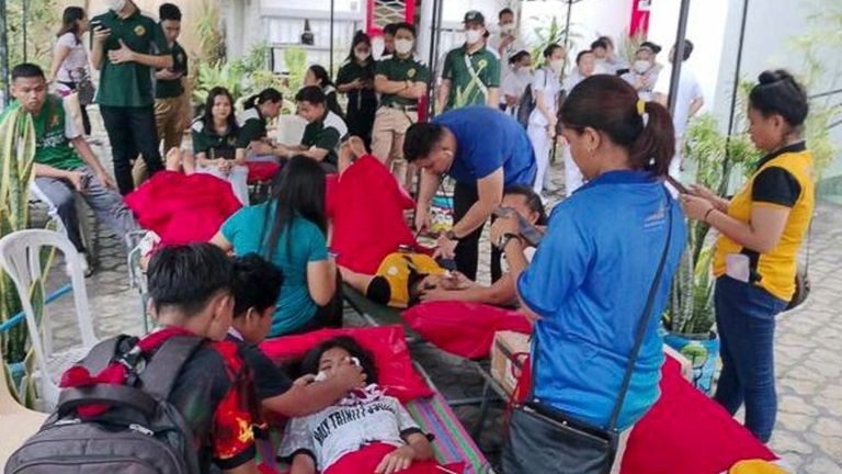 Red Cross volunteers providing assistance in General Santos City in the southern Philippines Pic: AP