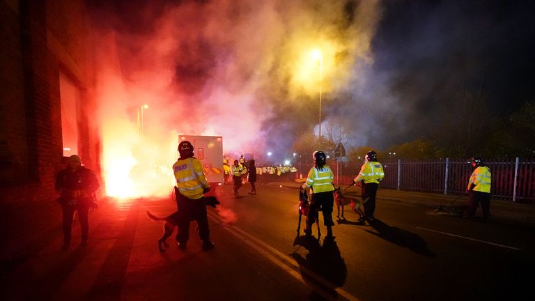 Police attempt to put out flares that have thrown towards them outside the stadium before the UEFA Europa Conference League Group E match at Villa Park, Birmingham. Picture date: Thursday November 30, 2023.

