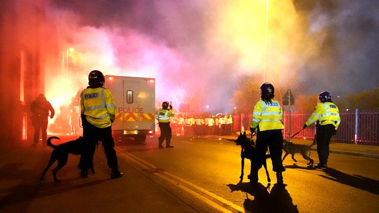 Police attempt to put out flares that have thrown towards them outside the stadium before the UEFA Europa Conference League Group E match at Villa Park, Birmingham. Picture date: Thursday November 30, 2023.

