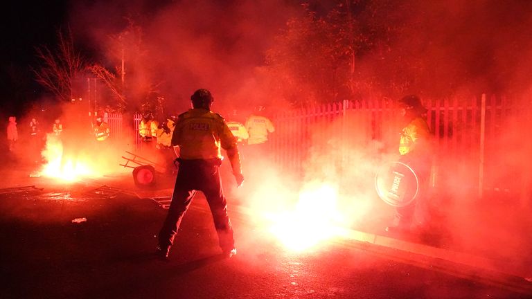 Police attempt to put out flares that have thrown towards them outside the stadium before the UEFA Europa Conference League Group E match at Villa Park, Birmingham. Picture date: Thursday November 30, 2023.


