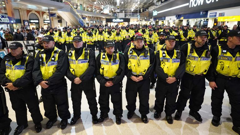 Police line up on the concourse at Waterloo Station