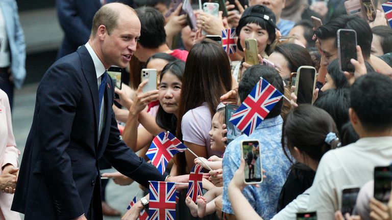 William greeted crowds. Pics: AP