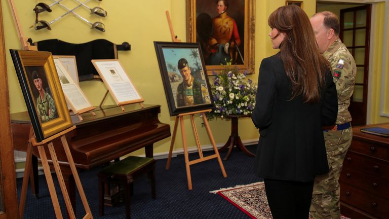 Princess of Wales looks at the pictures of the fallen soldiers of the Queen&#39;s Dragoon Guards Regiment during her first visit to 1st The Queen&#39;s Dragoon Guards at Robertson Barracks, Dereham in Norfolk